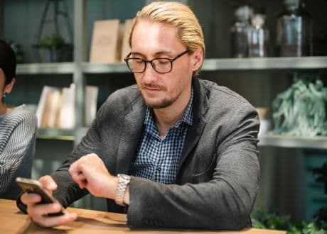 man looking at his watch