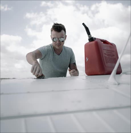 man doing maintenance on a plane