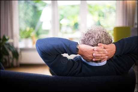 man relaxing on a couch