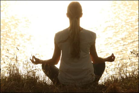 woman sitting in yoga position