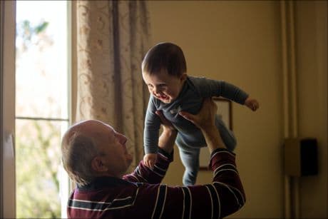 grandparent holding a grandchild