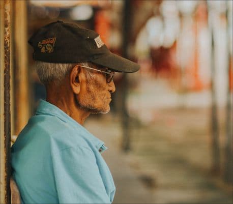 older man staring out into the day